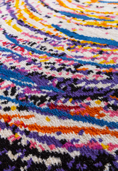 White rug with multicolour spiral, close-up