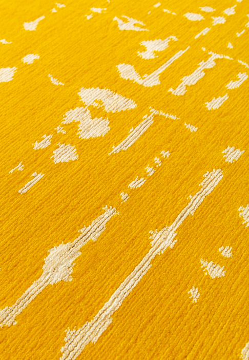 Yellow and white graphic rug, close-up