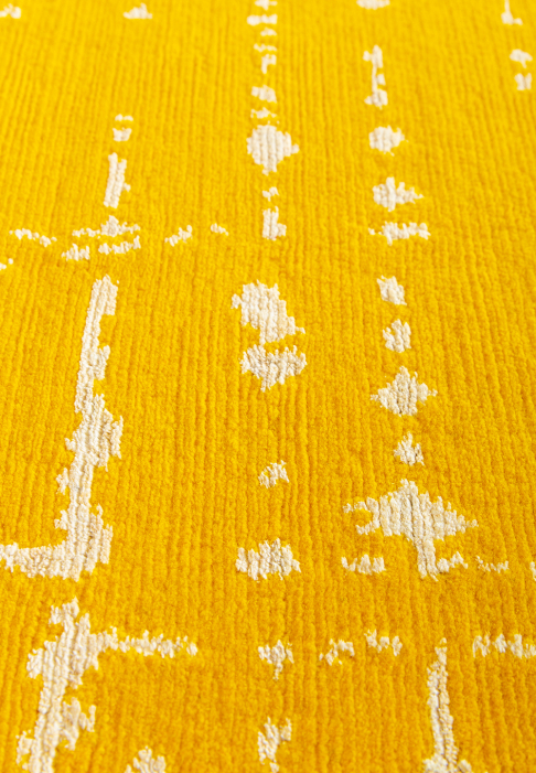 Yellow and white graphic rug, close-up