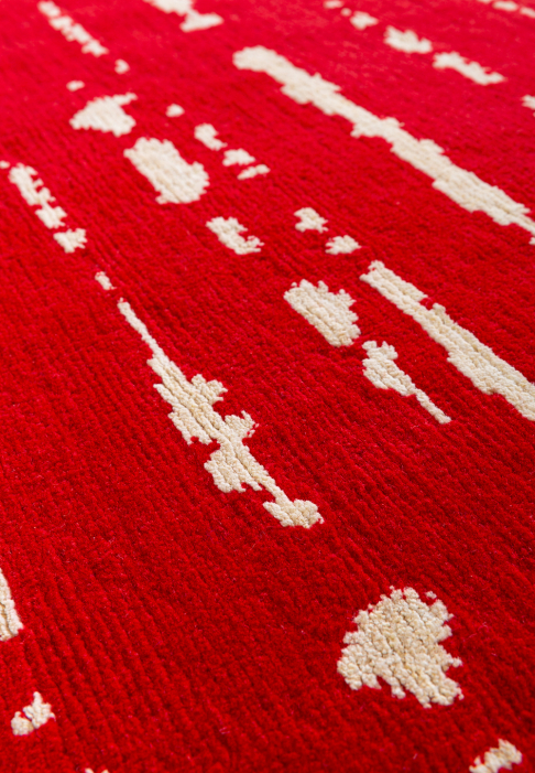 Red and white graphic rug, close-up