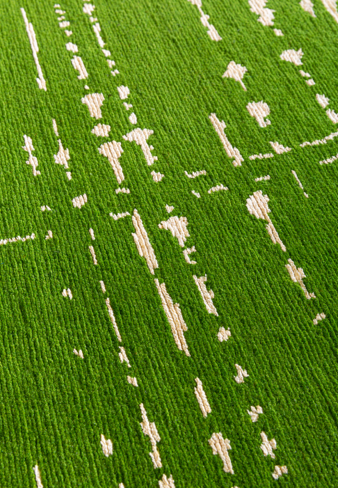 Green and white graphic rug, close-up
